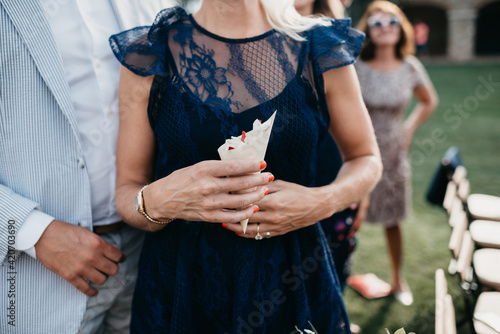 wedding guest holding confetti photo