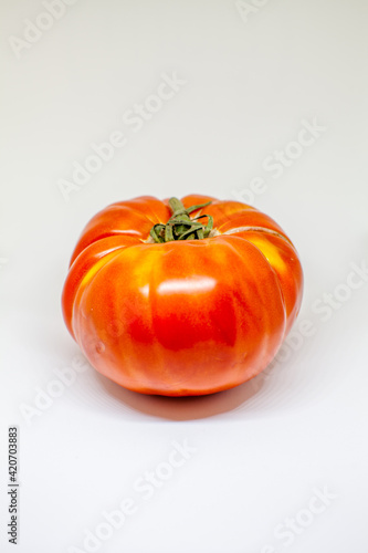 Ripe red tomato isolated in white