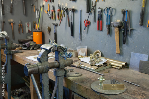 workbench with tools for metalwork photo