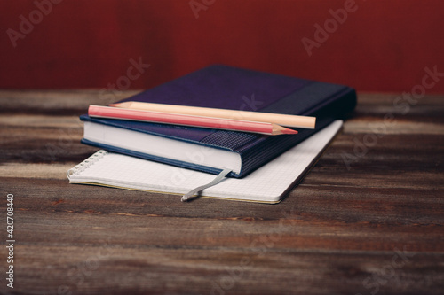 books notepads pens on wooden table pencil office writing