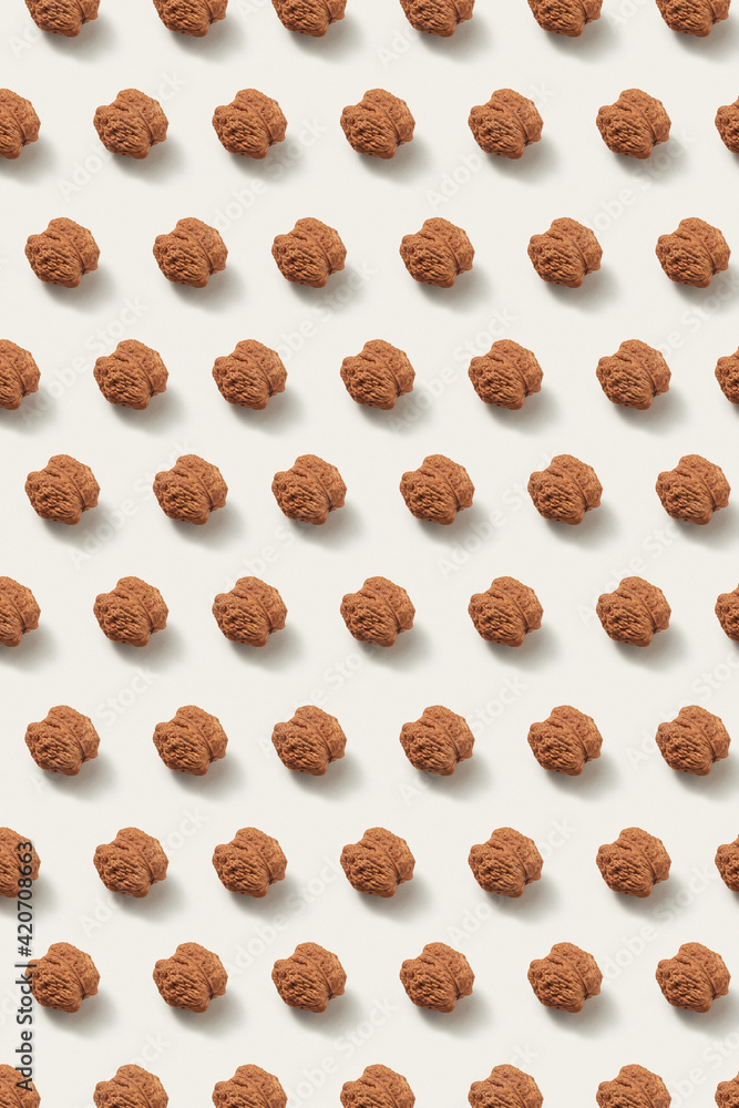 Vertical pattern from whole ripe organic walnuts. Vertical pattern from whole ripe organic walnuts.