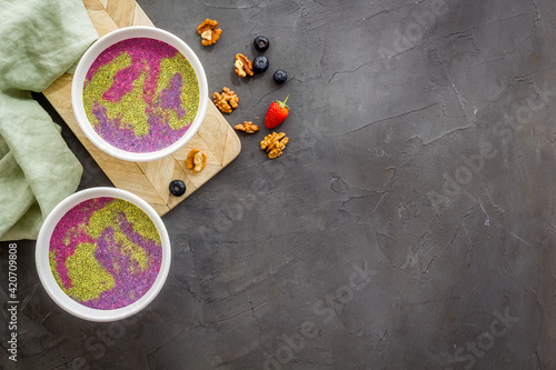 Acai smoothies bowles with chia seeds and superfoods, top view