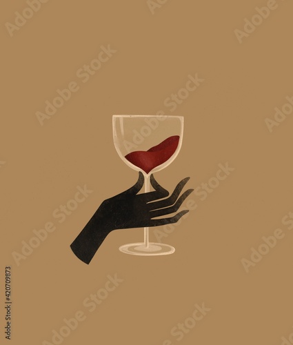Hand with a glass of red wine