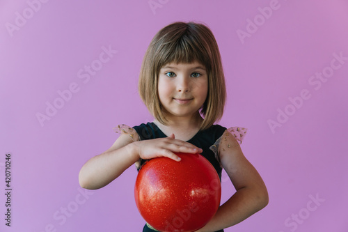 Future champion in rhythmic gymnastics. Children's sports competitions. Children's training photo