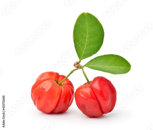 Two Juicy red Acerola cherry fruits with green leaf isolated on white background.