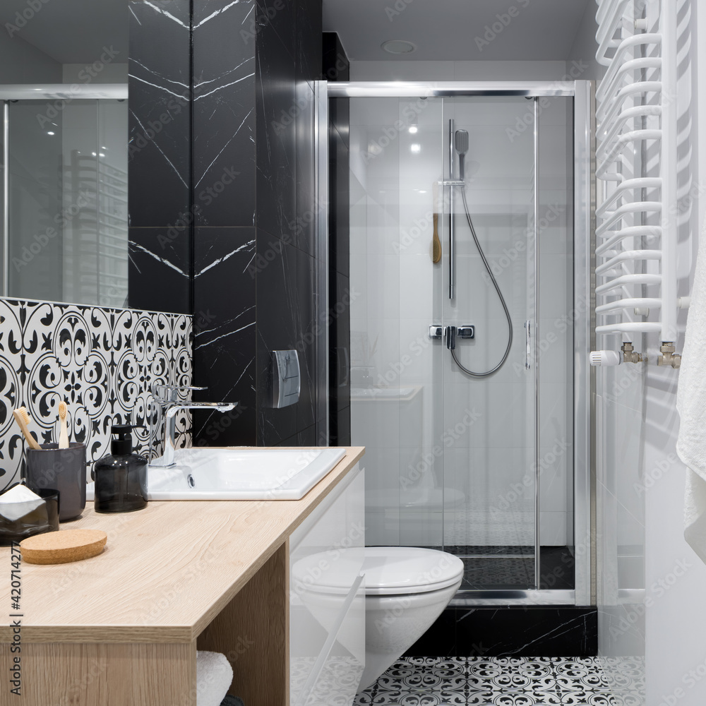 Functional and small bathroom with shower Stock Photo | Adobe Stock