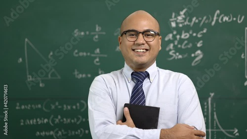 Young asian teacher man teaching video conference with student. Male Indian teacher training the mathematics in classroom from online course.