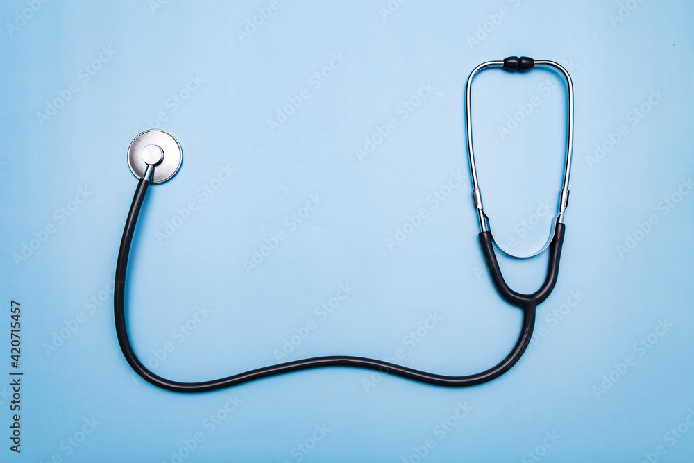 Stethoscope on a blue background, top view Stethoscope on a blue background, top view
