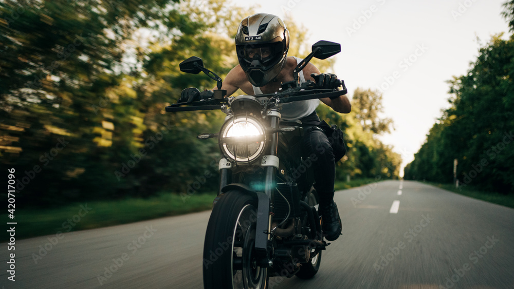 Motorcyclist Riding Fast On The Open Road Motorcyclist Riding Fast On The Open Road