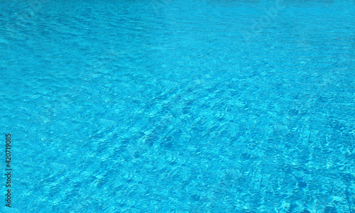 Swimming pool water surface in the sunlight