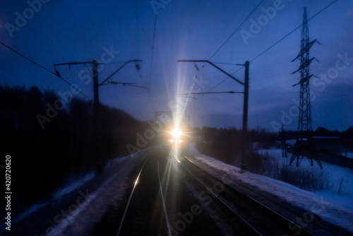 A train is coming - view from the last wagon window in the trans siberian train. photo
