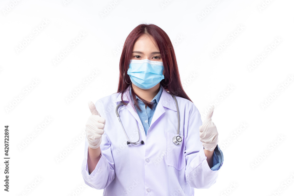 Beautiful portrait friendly asian female doctor or nurse in medical mask and hand in glove thumbs up at medical clinic isolated on white background. Mask and glove to prevent virus concept. Beautiful portrait friendly asian female doctor or nurse in medical mask and hand in glove thumbs up at medical clinic isolated on white background. Mask and glove to prevent virus concept.