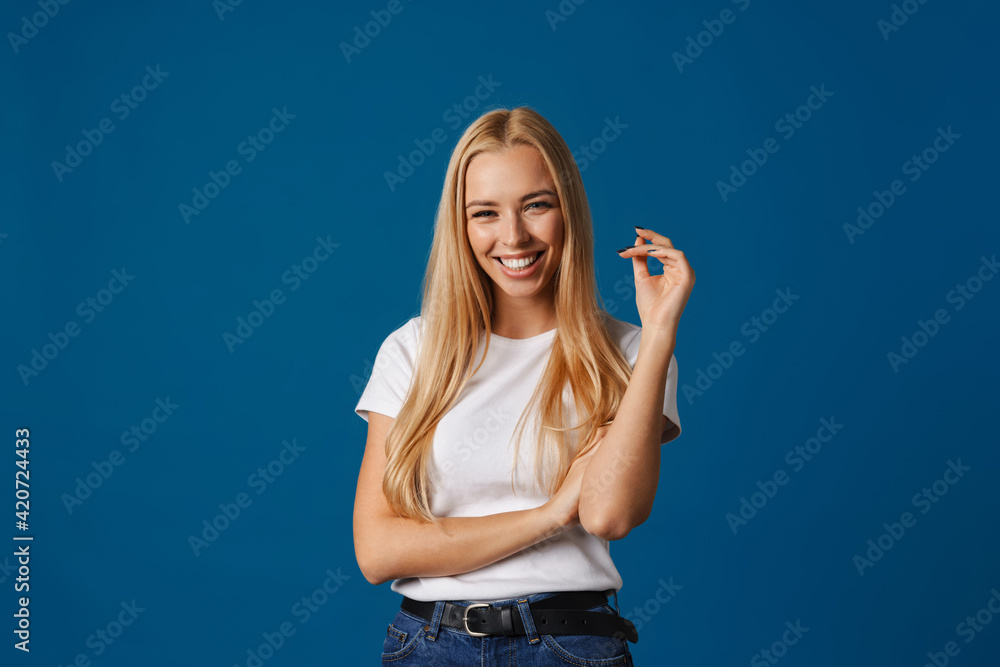 Blonde young happy woman smiling and looking at camera Blonde young happy woman smiling and looking at camera
