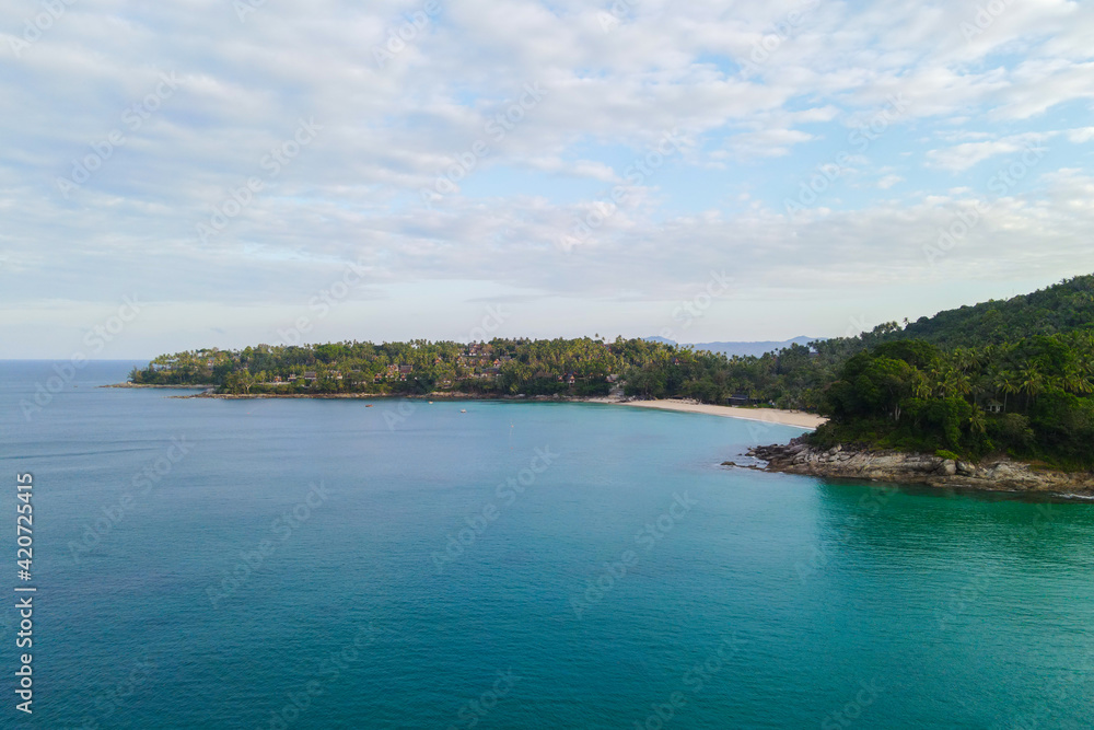 Naklejka premium beautiful sand beach aerial view drone shot on a Surin beach, Phuket Thailand. wallpaper and background