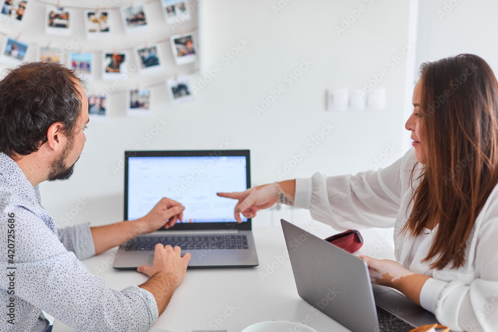 Young couple working from home Young couple working from home