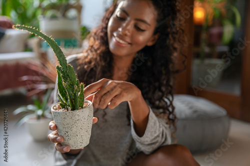 Woman taking care of home plants