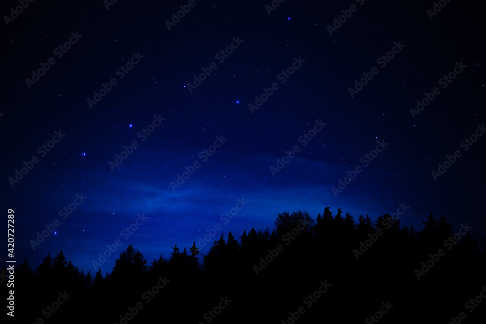 Endless starry sky, over a mysterious landscape 