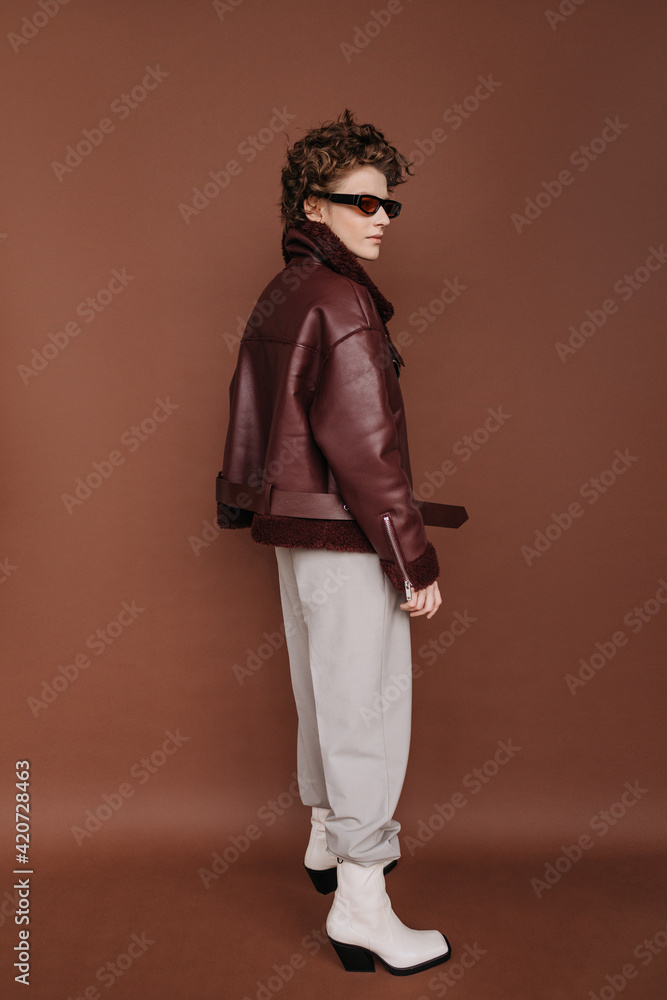 Minimalistic Fashion portrait of Young woman in fashionable outfit Minimalistic Fashion portrait of Young woman in fashionable outfit