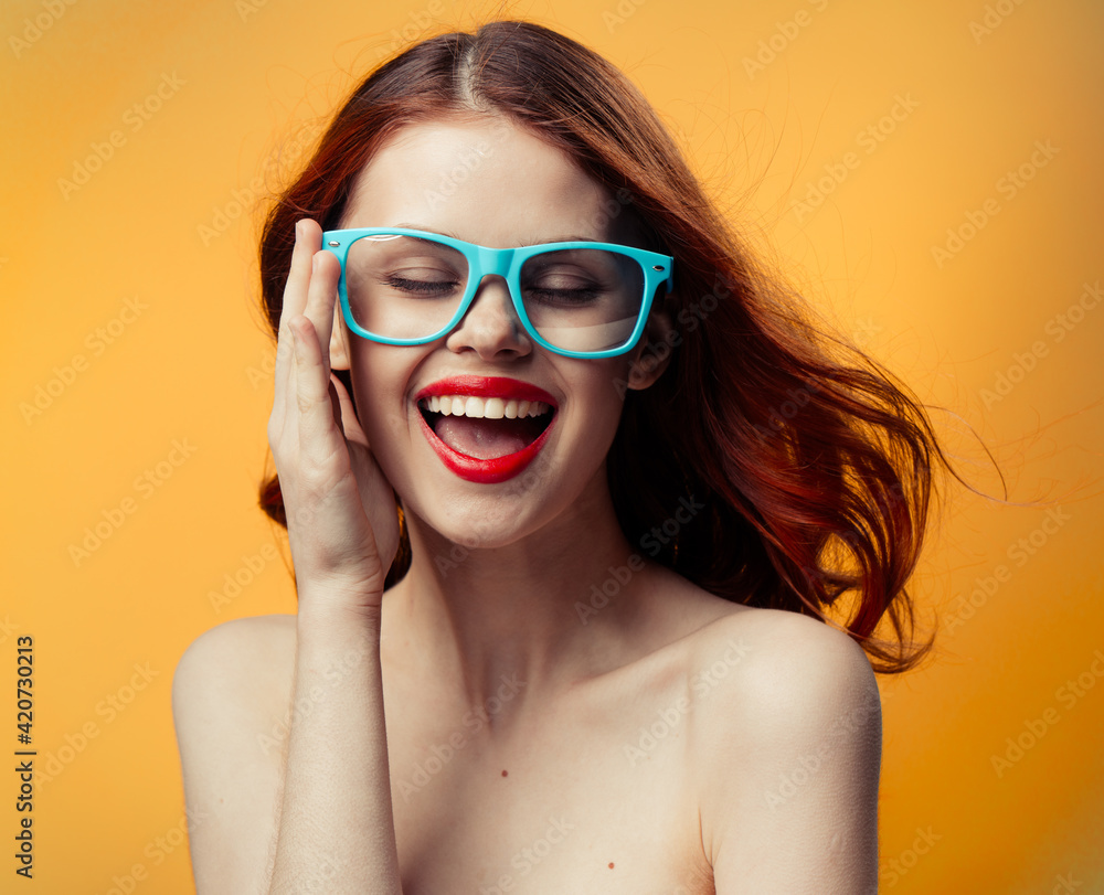 attractive woman naked shoulders red lips blue glasses studio attractive woman naked shoulders red lips blue glasses studio