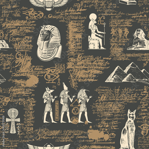 Seamless pattern on an ancient Egyptian theme with images of Egyptian gods and scribbles imitating handwritten text. Abstract vector background in retro style. Wallpaper, wrapping paper, fabric