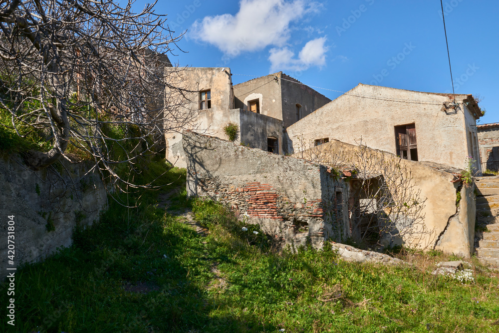 entrances and facades of old decaying houses ruins of a ghost town in Italy