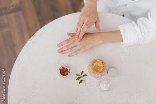 Crop female applying powder on hand photo