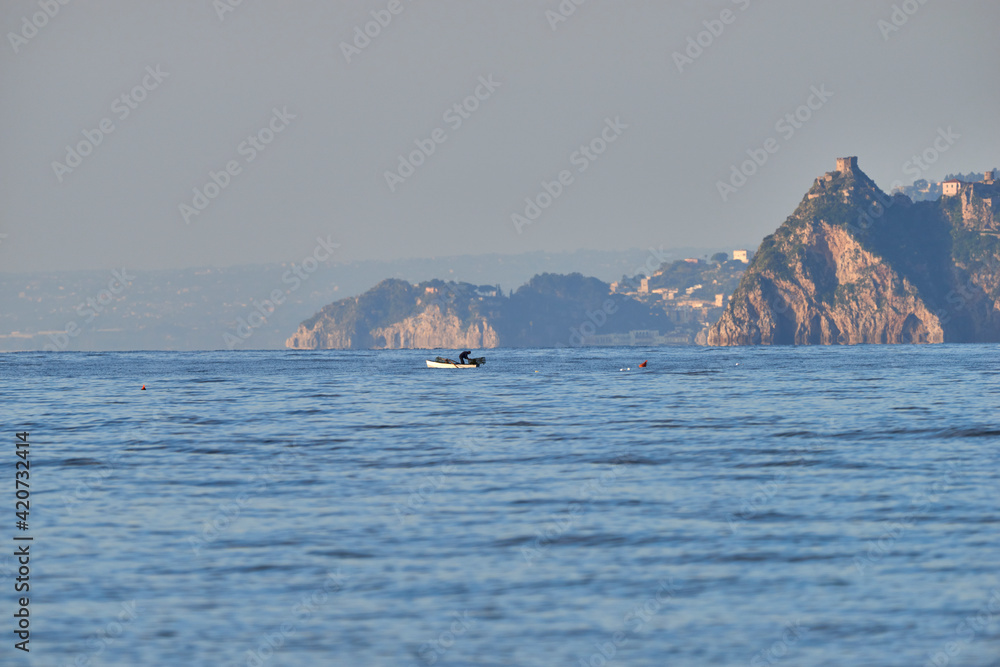 fishermen on the boat in the early morning on the sea of Sicily fishermen on the boat in the early morning on the sea of Sicily