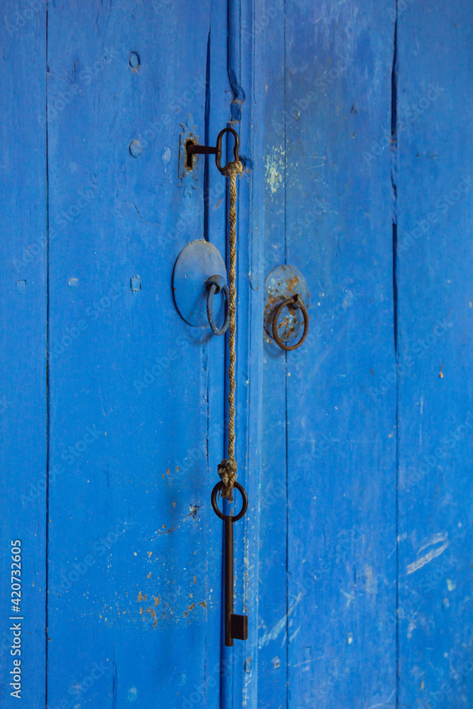 blue old door with two keys blue old door with two keys