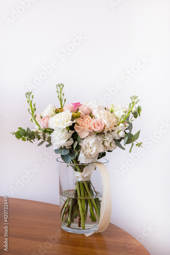 Wallpaper Mural Beautiful wedding bouquet on bright background. Bouquet consists of pink roses, ranunculus, eucalyptus Torontodigital.ca
