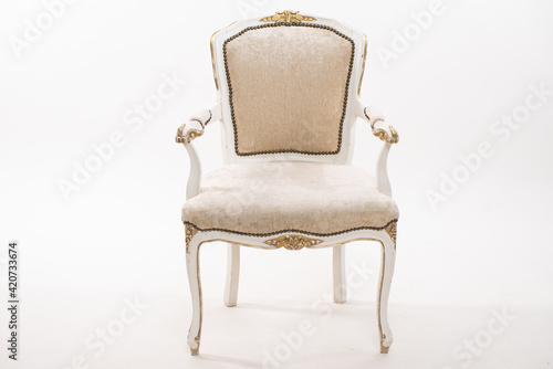 Vintage white armchair on white background