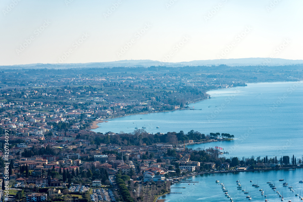 Aerial view of the Lake Garda (Lago di Garda) with the small villages of Bardolino, Cisano and Lazise, view from the Rocca di Garda, small hill overlooking the lake. Verona province, Veneto, Italy, Eu