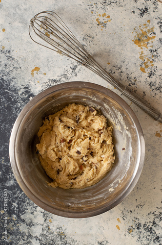 Making some cookies: cookie dough in the making, with a wisk and a spoon photo