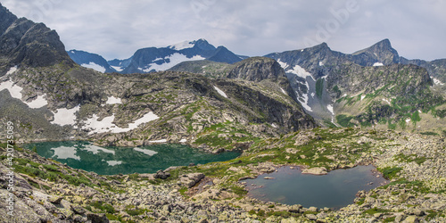 Two mountain lakes of different colors, summer travel