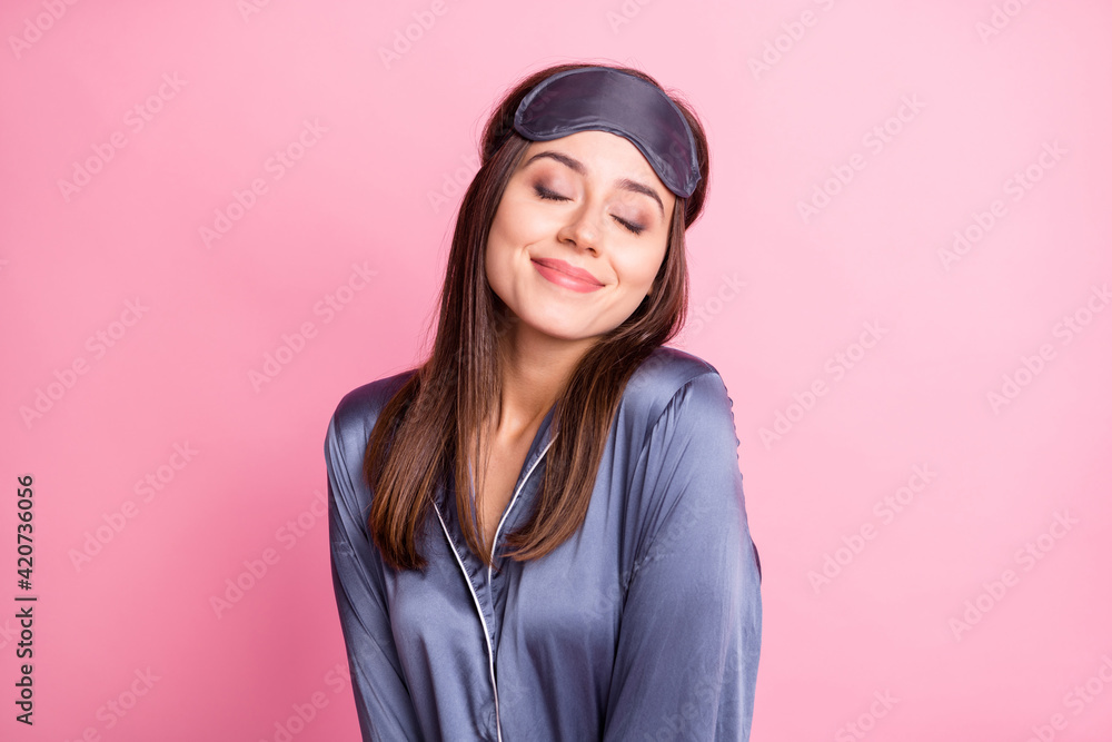 Photo portrait of delighted smiling woman with closed eyes isolated on pastel pink colored background Photo portrait of delighted smiling woman with closed eyes isolated on pastel pink colored background