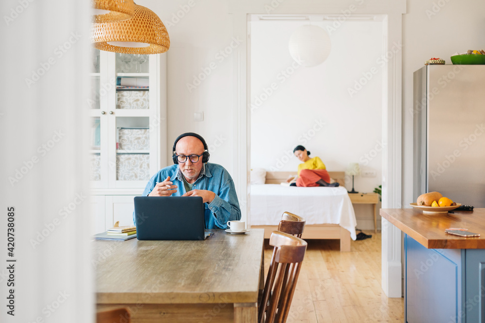 A Man Working on a Computer at Home A Man Working on a Computer at Home