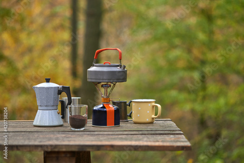 Tourist set with metal cookware for making coffee. photo