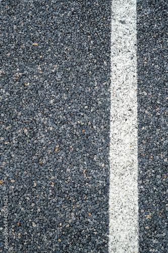 White stripe on road, line marking on an asphalt road.