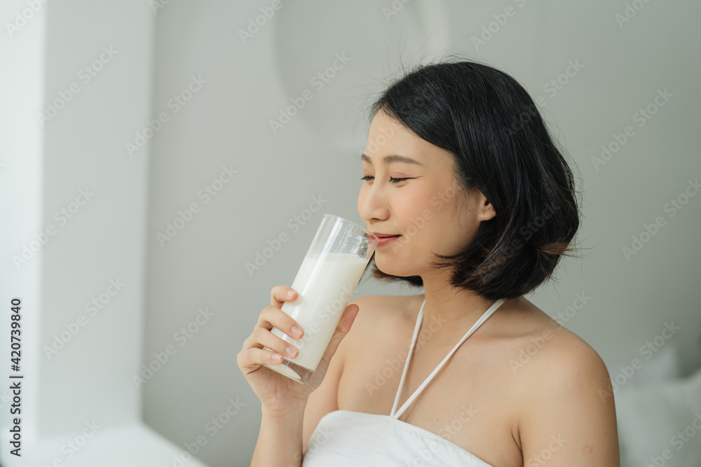 Young pregnant woman with glass of milk standing Young pregnant woman with glass of milk standing