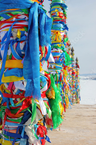 Serge. Sacred poles with colored ribbons in island Olkhon. Burkhan, Lake Baikal © Борис Александров
