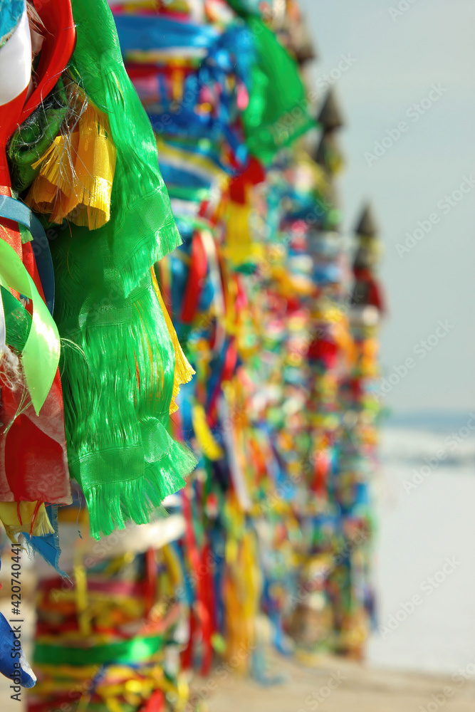 Serge. Sacred poles with colored ribbons in island Olkhon. Burkhan, Lake Baikal