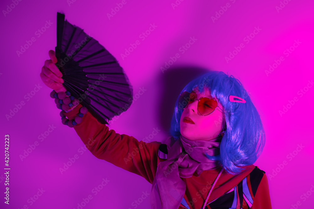 Little girl posing with a fan for a photo shoot Little girl posing with a fan for a photo shoot