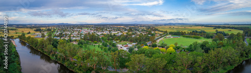 Wide aerial panorama of Orbost town nested near Snowy River in Victoria, Australia