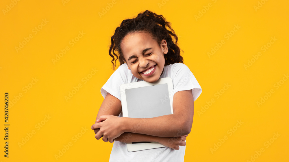 Technology Lover. Excite black girl hugging personal computer Technology Lover. Excite black girl hugging personal computer