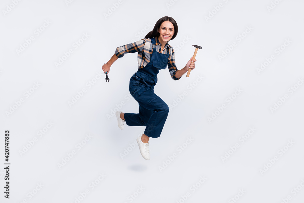 Full size photo of happy smiling excited woman constructor running with hammer isolated on white color background