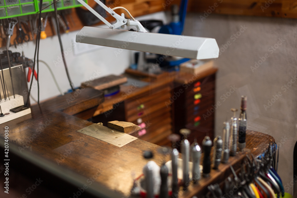 table and tools of a jewelry workshop, jeweler craftsman. table and tools of a jewelry workshop, jeweler craftsman.