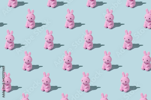 Easter pattern made with easter bunny on blue background. Creative minimal holiday concept. Flat lay, top view
