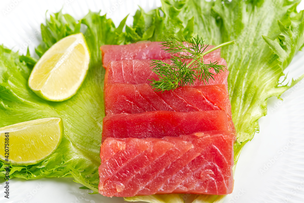 tuna sushi, Tuna carpaccio, tuna sashimi with vegetables. healthy eating with seafood, we cook at home tuna sushi, Tuna carpaccio, tuna sashimi with vegetables. healthy eating with seafood, we cook at home