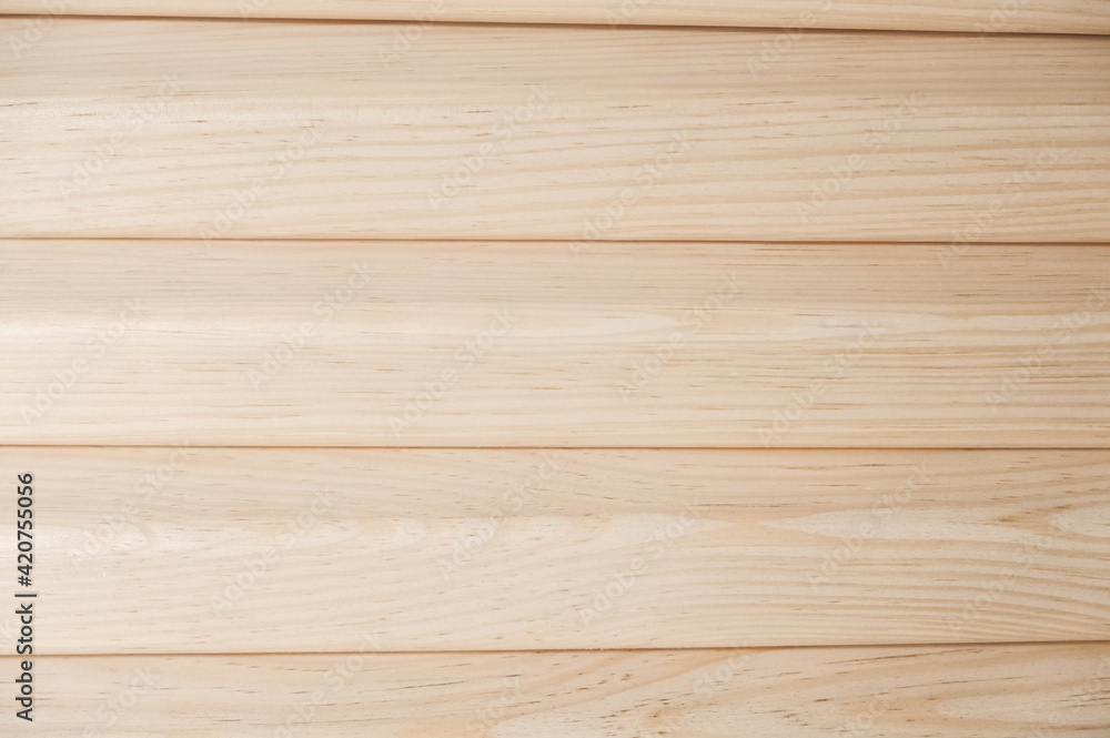 Joiner s boards from light natural wood are stacked on each other. Timber harvesting. Details of a lumber bar close-up. Hobbies of needlework, woodworking Joiner s boards from light natural wood are stacked on each other. Timber harvesting. Details of a lumber bar close-up. Hobbies of needlework, woodworking