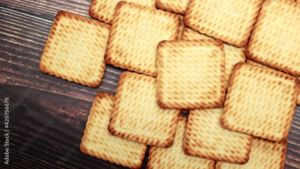 Top View Of Shortbread Cookies On A Wooden Background. Panning Dolly Slider Shot. Baking And Bakery Concept. Selling Dessert In The Trade. Top View Of Shortbread Cookies On A Wooden Background. Panning Dolly Slider Shot. Baking And Bakery Concept. Selling Dessert In The Trade.