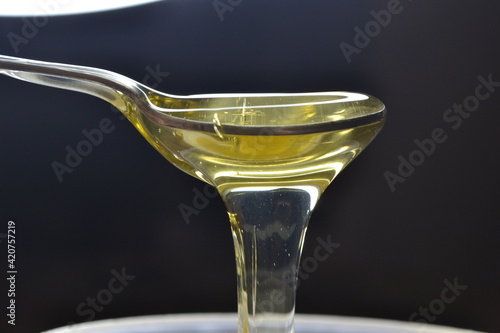 honey dripping from a spoon